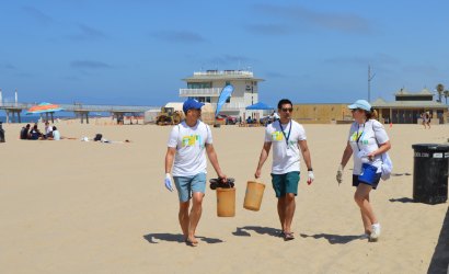 Ares employees volunteering to clean up a beach